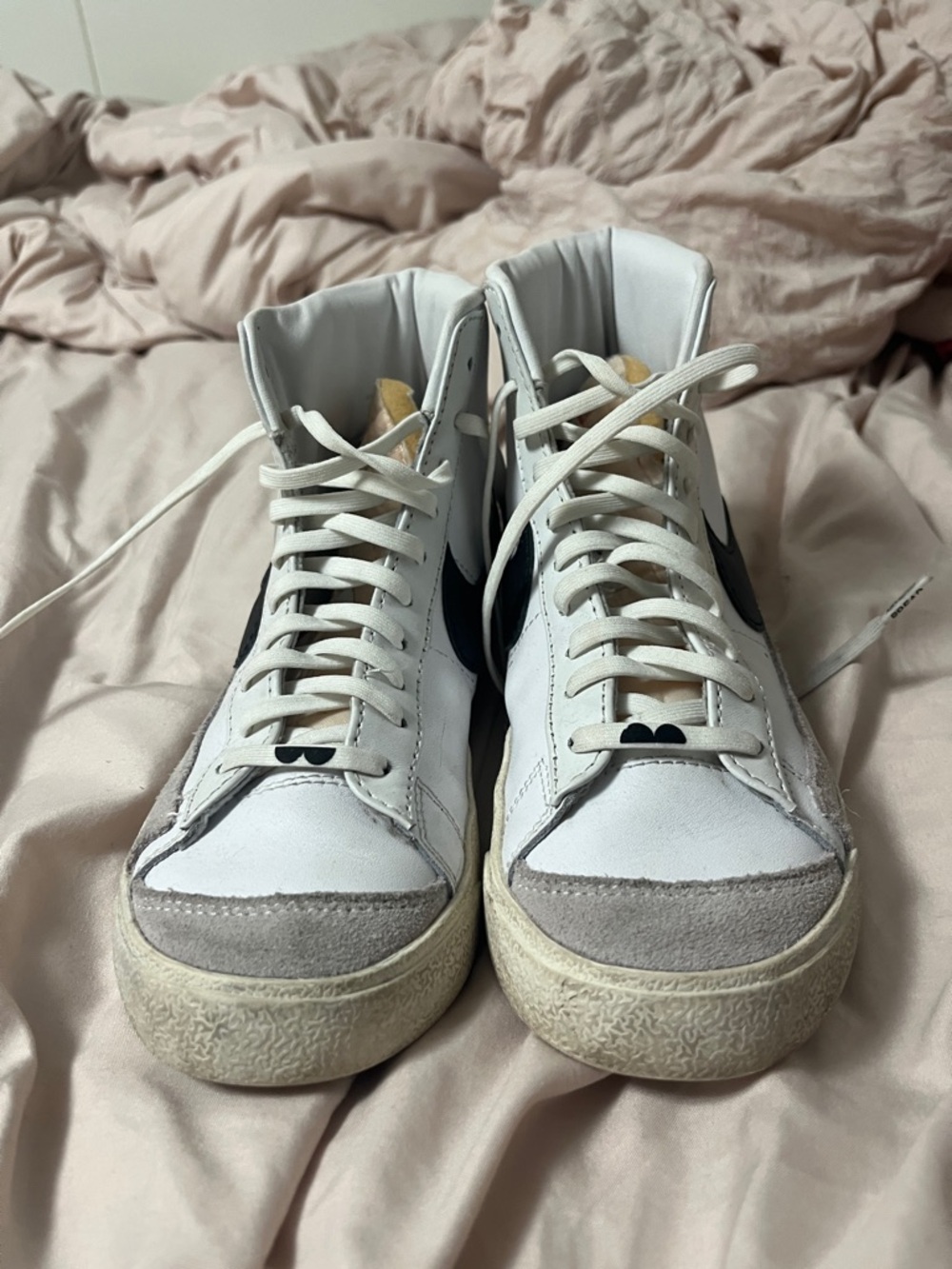 Nike White High-Top Sneakers with Black Swoosh